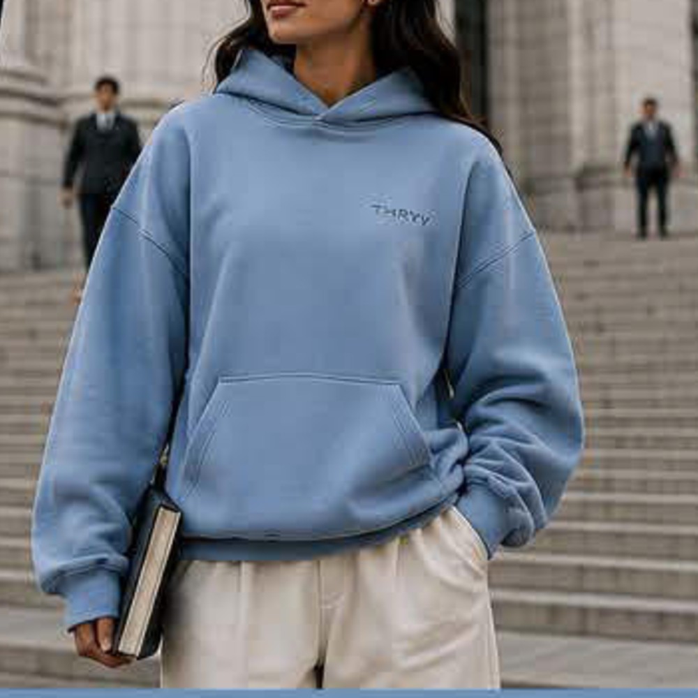 Customer photo wearing Thryv in Carolina Blue on outdoor stairs